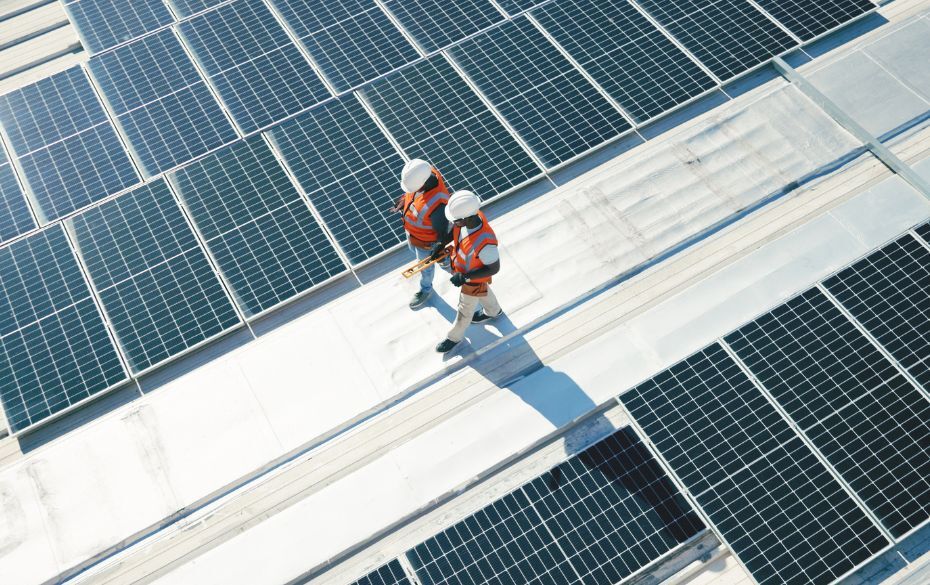 Two workers and solar panels